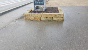 Image of signage in a planter