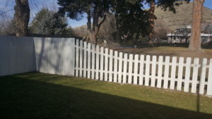 Image of picket fence escalating into full fence