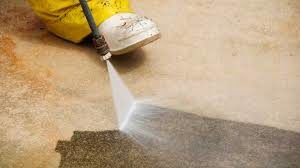 Image of floor being power washed