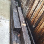 Image of side of house filled with railroad ties