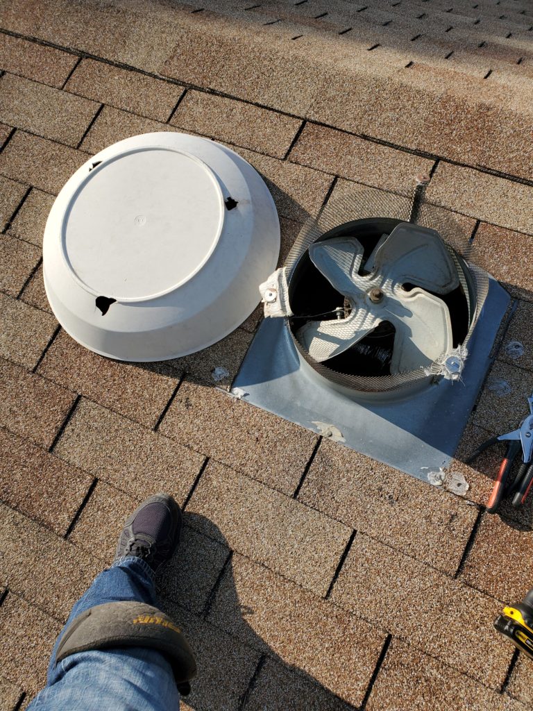 Image of an attic fan cover repair