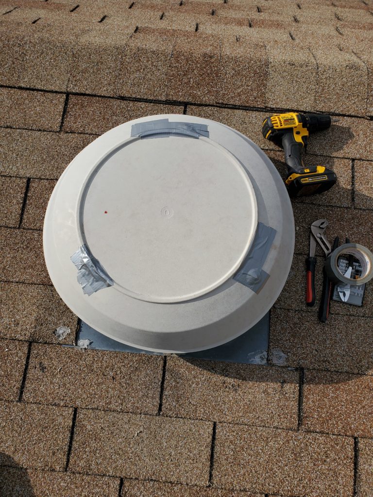 Image of unavailable attic fan cover repaired for temporary use