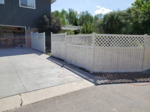 Image of white washed backyard fence